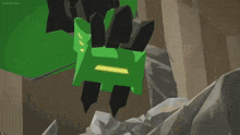 a green and black robot with a yellow light on its face