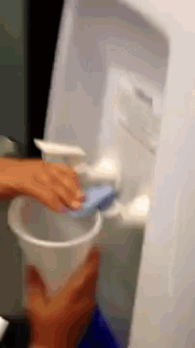 Girl Can'T Figure Out The Water Cooler GIF