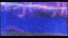 a blurry picture of a purple and blue background with chinese writing on it