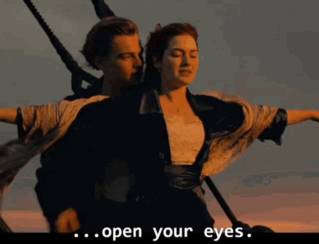 a man and a woman in a scene from the movie titanic