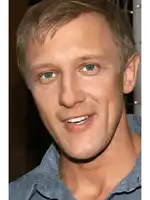 a close up of a man 's face with his mouth open