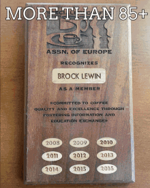 a wooden plaque recognizes brock lewin as a member of assn of europe