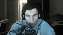 a man is wearing headphones and a microphone
