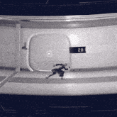 a black and white photo of a room with a sign that says 2b on it