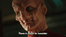 a close up of a face with the words " there is much to consider "