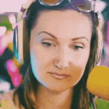 a woman with a nose ring is wearing headphones