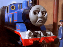 a thomas the tank engine with a sad look on its face