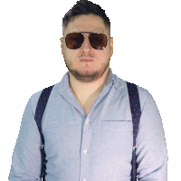 a man wearing suspenders and sunglasses looks serious