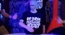 a man wearing a shirt that says be your mythical best