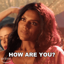 a woman is asking how are you in a pink shirt