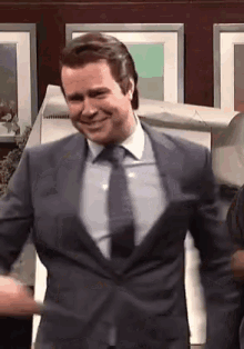 Man On Suit Spin GIF - Man On Suit Spin Pointing GIFs