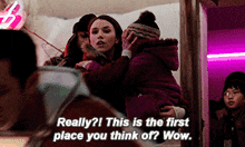 a woman holding a child with the words " really this is the first place you think of wow "