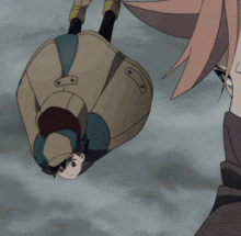a man in a hat is flying through the air while another man watches