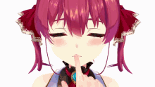 a close up of a girl 's face with her finger on her lips