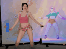 a woman dancing in front of a screen that says " un deux trois so "