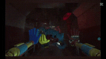 a blue stuffed animal with sharp teeth is holding a yellow teddy bear in a dark room .