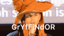 a man is wearing a hat that says gryffindor on it