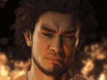 a man with a beard has his eyes closed