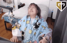 a woman wearing headphones is sitting in front of a microphone ..