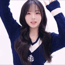 a girl wearing a blue sweater that says rld