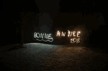 a sign that says bonneannee crc is lit up at night