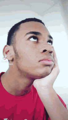 a close up of a man 's face with tiktok written on the bottom