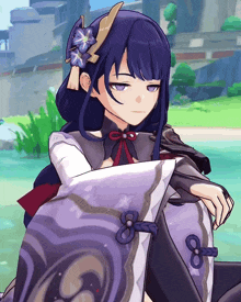 a girl with purple hair and a flower in her hair is sitting on a pillow with the number 8 on it