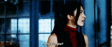 a woman in a red top is asking where 's mine ?