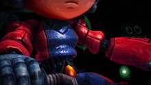 a close up of a robot 's arm with a red light behind it