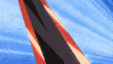 a red and black object is against a blue background