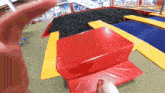 a person is jumping on a trampoline in a mall