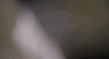 a person taking a picture of a man 's face with a camera