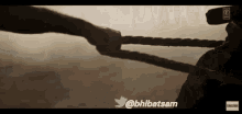 two people pulling a rope with the hashtag @bhibatsam