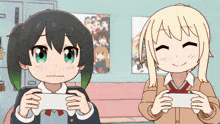 two anime girls are playing a video game and one of them is making a funny face