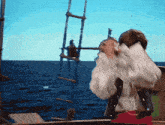 a man in a pirate costume stands on a boat looking out over the ocean
