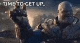 thanos from the movie avengers endgame is giving a thumbs up .