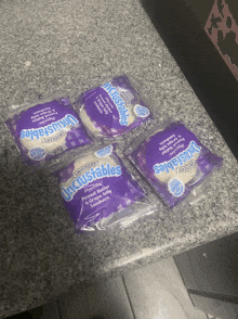four packages of uncrustables are on a counter top