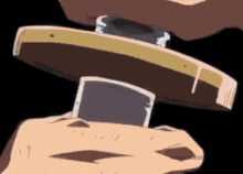 a close up of a person holding a piece of wood in their hand