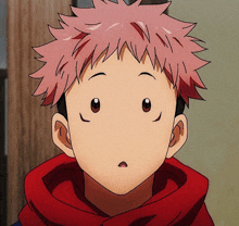 a close up of a person 's face with a red hoodie on