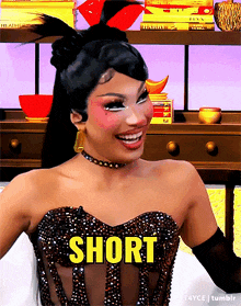 a woman in a black dress with the word short written on it