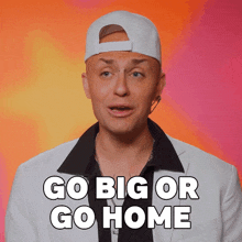 a man wearing a white hat and a white jacket says go big or go home