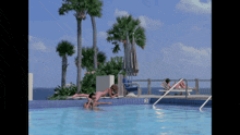 two people are swimming in a pool with the number 3 on the side