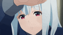 a girl with white hair and red eyes holds her hand to her head