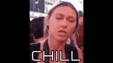 a woman is making a funny face and the word chill is on the screen behind her