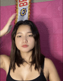 a woman with a sash on her head that says bf on it