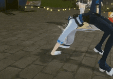 a video game character is doing a handstand in front of a sign that says " game "