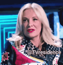 a woman wearing a leopard print jacket has the hashtag @tvresidence on her face