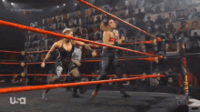 two women are wrestling in a ring with a referee and the word usa on the bottom
