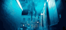 a person is floating in the air in a dark hallway .