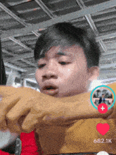 a young man 's face is shown with the number 682.1k on the bottom